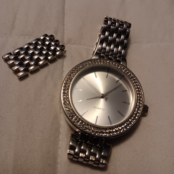 Silver watch with diamonds around it - Picture 1 of 4